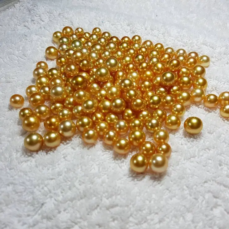 Picture of a cluster of gold pearls.