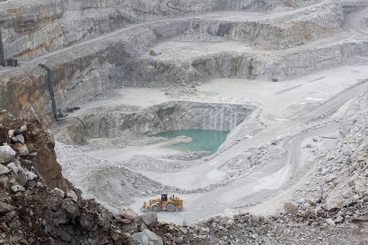 Picture of an open limestone quarry.
